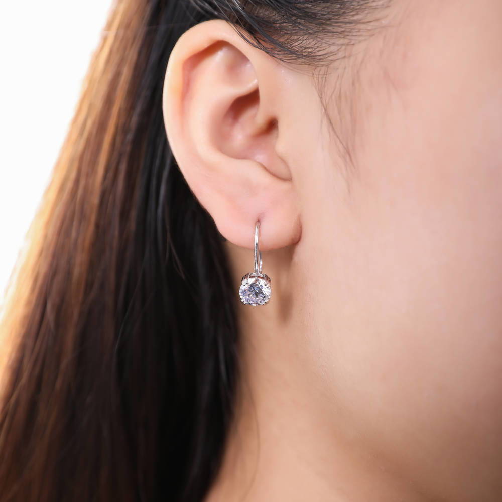 Model wearing Solitaire CZ Leverback Earrings in Sterling Silver, Rhodium Plated, 7mm, Default Title
