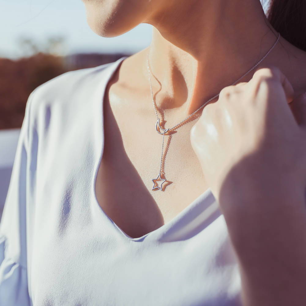 Model wearing Star Crescent Moon Lariat Necklace in Sterling Silver
