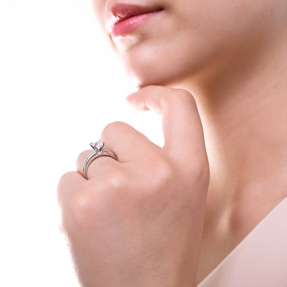 Model wearing Solitaire 1.2ct Princess CZ Ring Set in Sterling Silver, 9 of 11