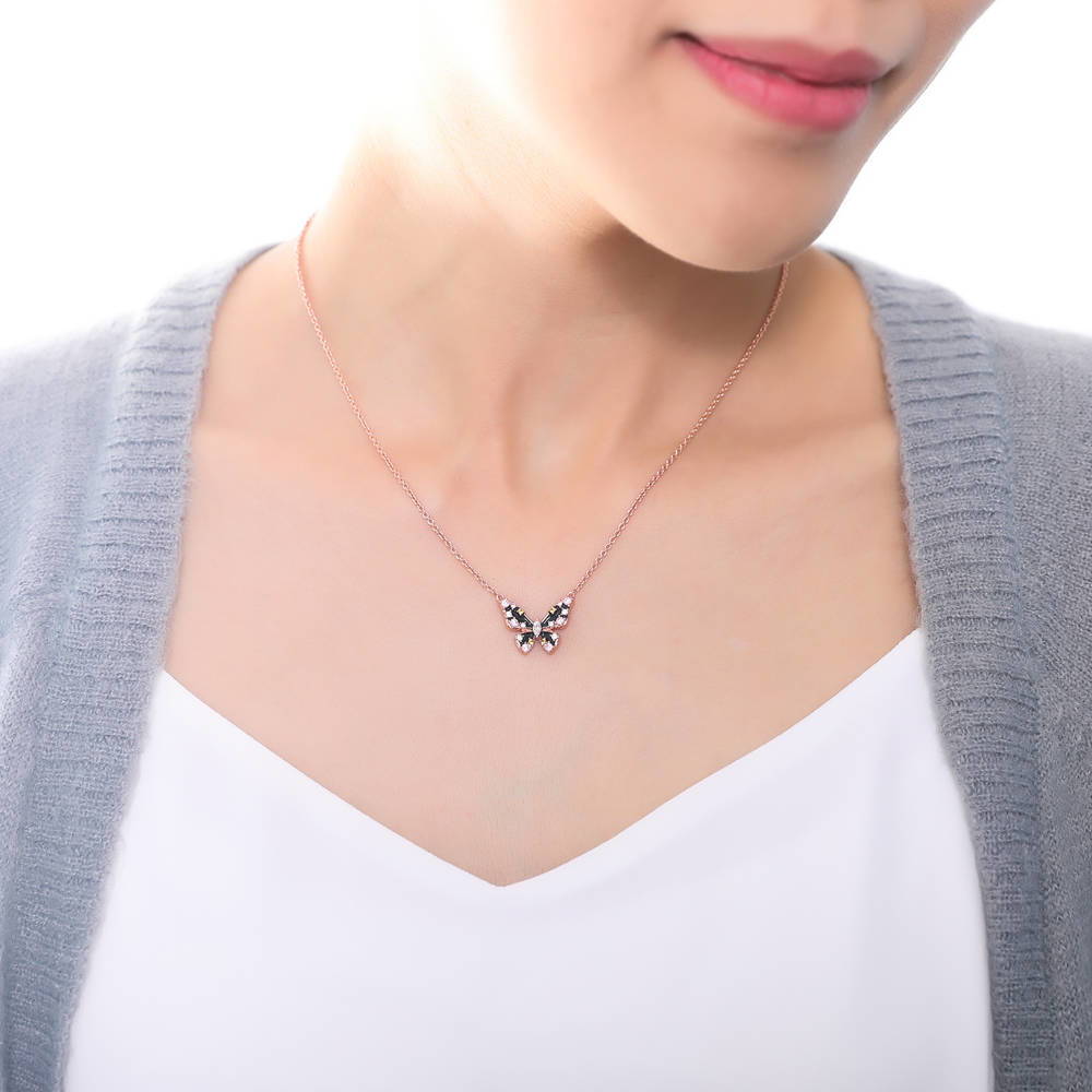 Model wearing Butterfly Enamel CZ Necklace in Rose Gold Flashed Sterling Silver