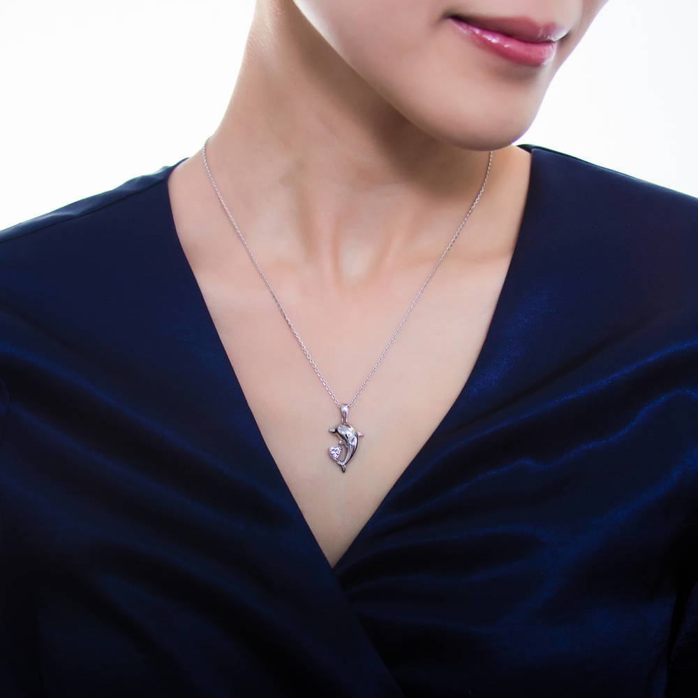 Model wearing Dolphin CZ Pendant Necklace in Sterling Silver