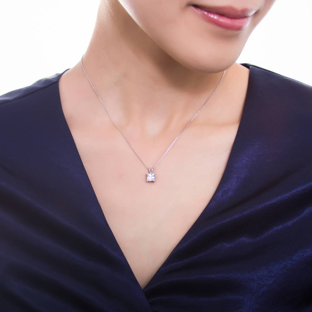 Model wearing Solitaire 1.2ct Princess CZ Pendant Necklace in Sterling Silver