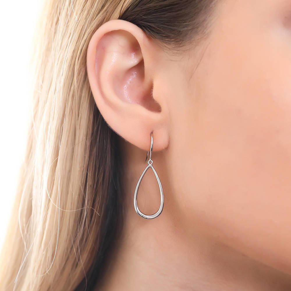 Model wearing Teardrop Fish Hook Dangle Earrings in Sterling Silver