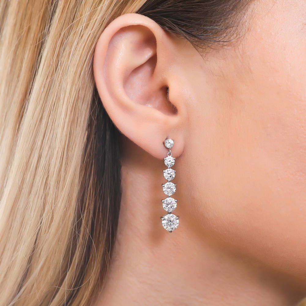 Model wearing Graduated CZ Dangle Earrings in Sterling Silver