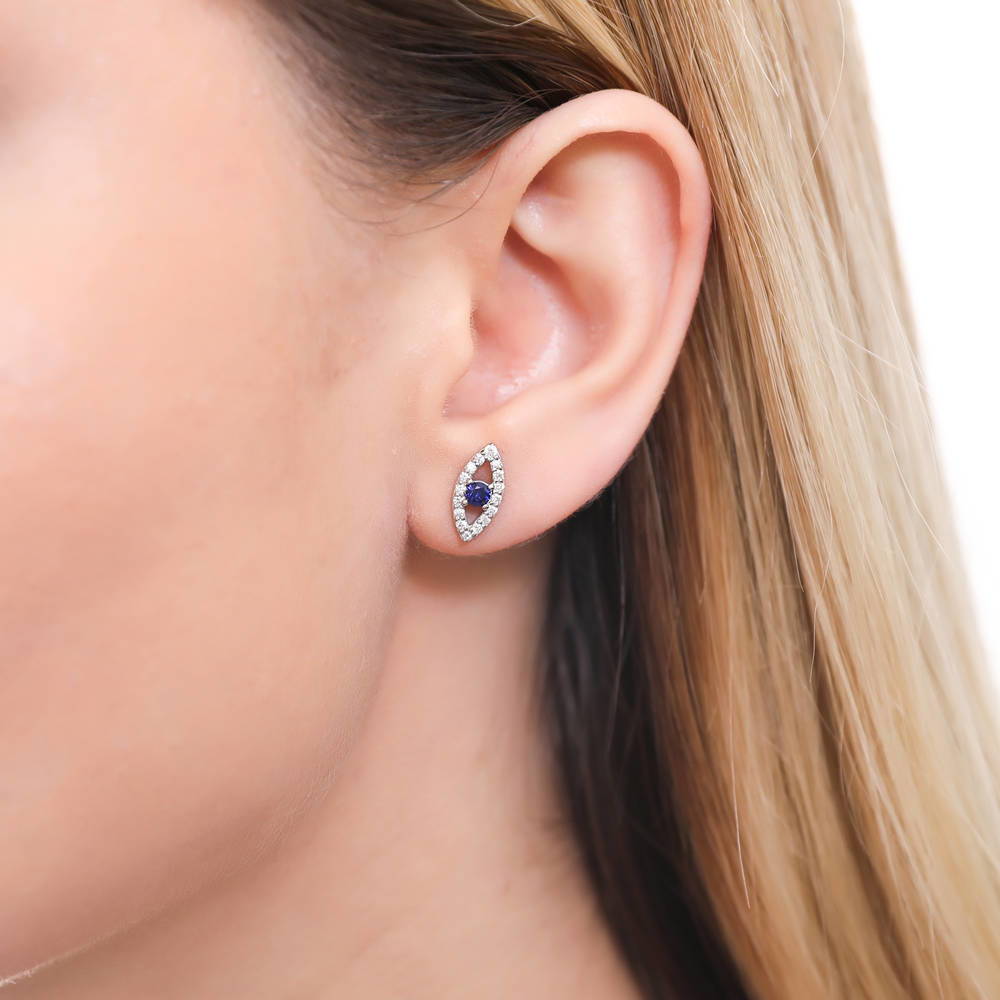 Model wearing Evil Eye CZ Stud Earrings in Sterling Silver