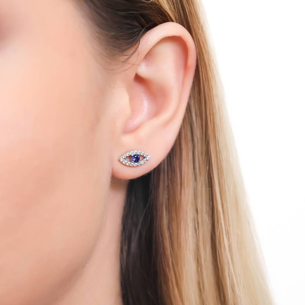 Model wearing Evil Eye CZ Stud Earrings in Sterling Silver