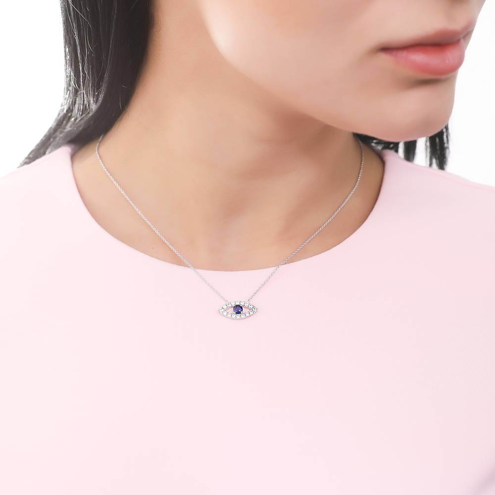Model wearing Evil Eye CZ Necklace and Earrings Set in Sterling Silver
