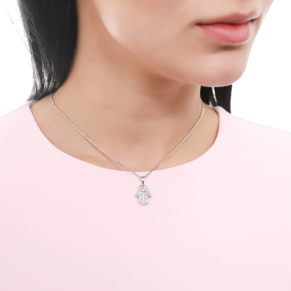 Model wearing Hamsa Hand CZ Necklace and Earrings Set in Sterling Silver