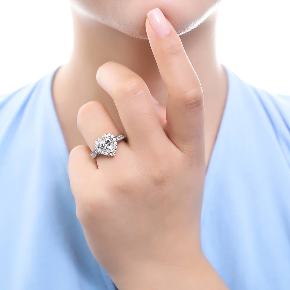 Model wearing Halo Heart CZ Statement Ring Set in Sterling Silver