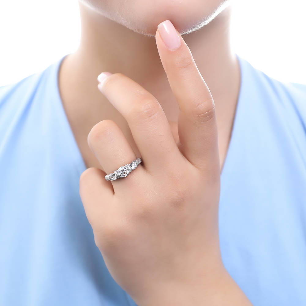 Model wearing 3-Stone Art Deco Round CZ Ring in Sterling Silver