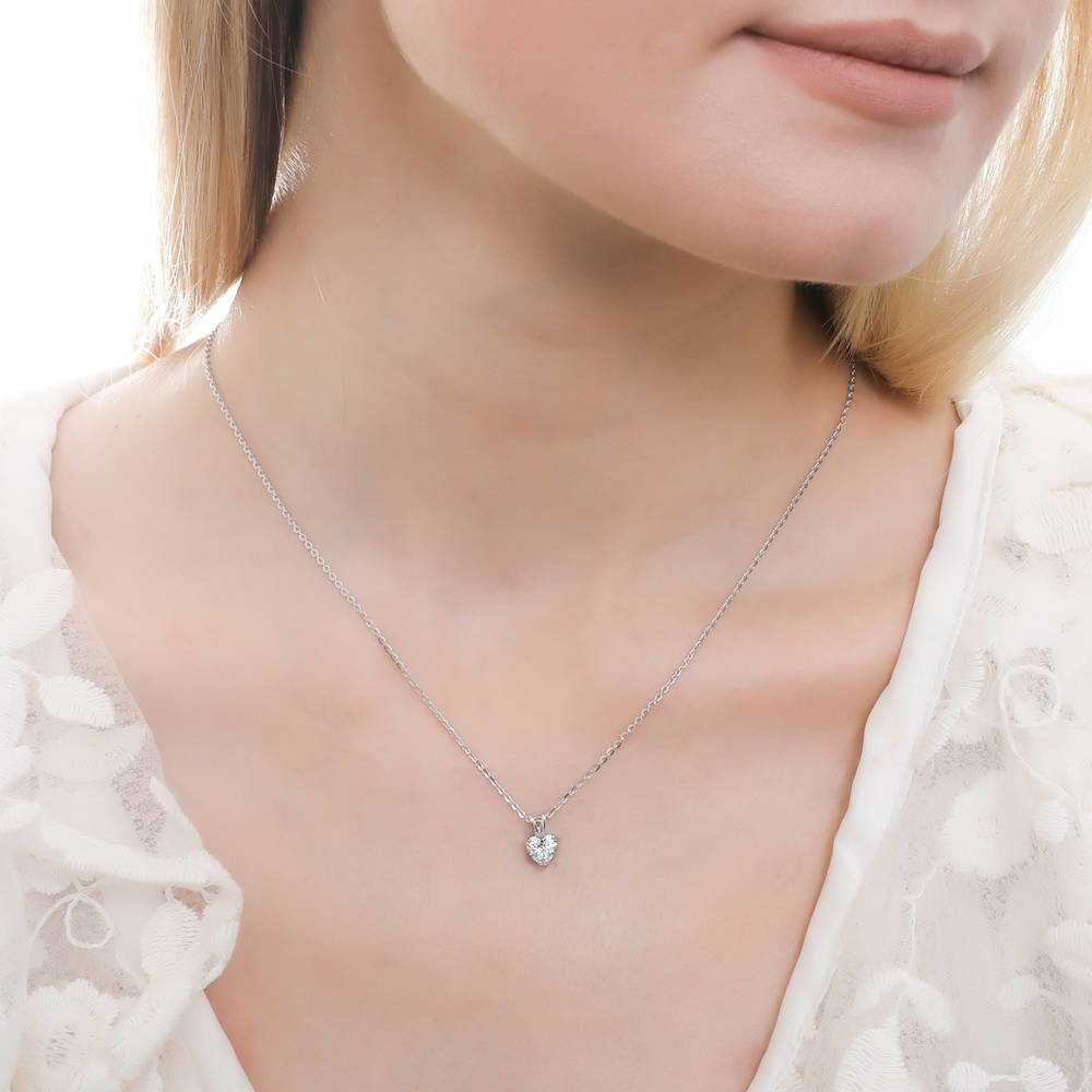 Model wearing Solitaire Heart 0.7ct CZ Pendant Necklace in Sterling Silver, 2 of 7