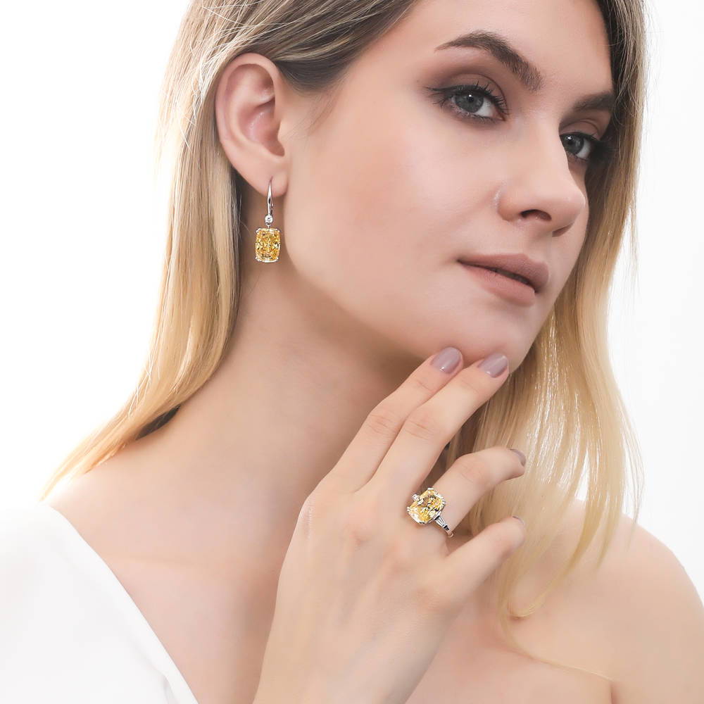 Model wearing Solitaire Canary Cushion CZ Leverback Earrings in Sterling Silver 18ct