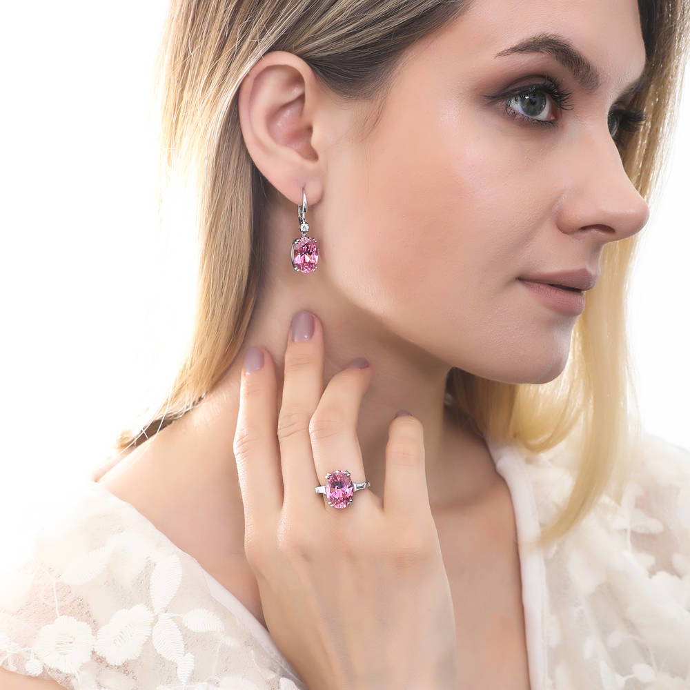 Model wearing Solitaire Pink Oval CZ Leverback Earrings in Sterling Silver 11.6ct