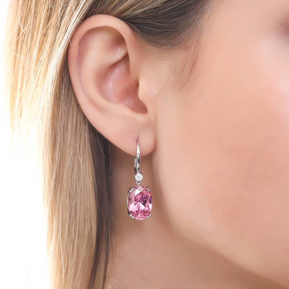 Model wearing Solitaire Pink Oval CZ Leverback Earrings in Sterling Silver 11.6ct