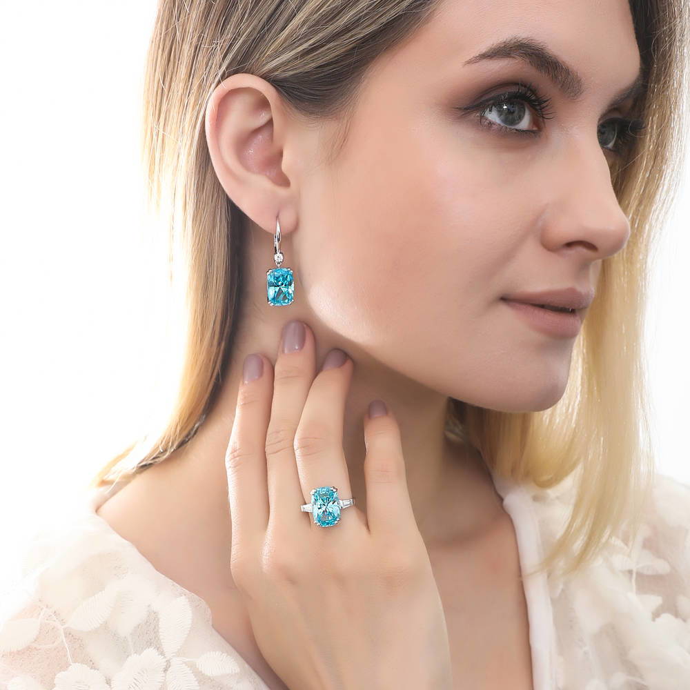 Model wearing 3-Stone Blue Cushion CZ Statement Ring in Sterling Silver