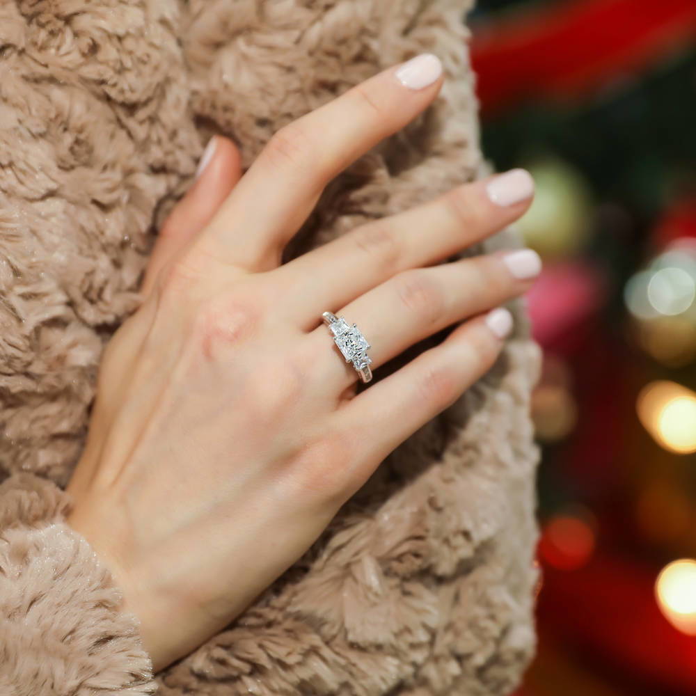 Model wearing 3-Stone Princess CZ Ring in Sterling Silver