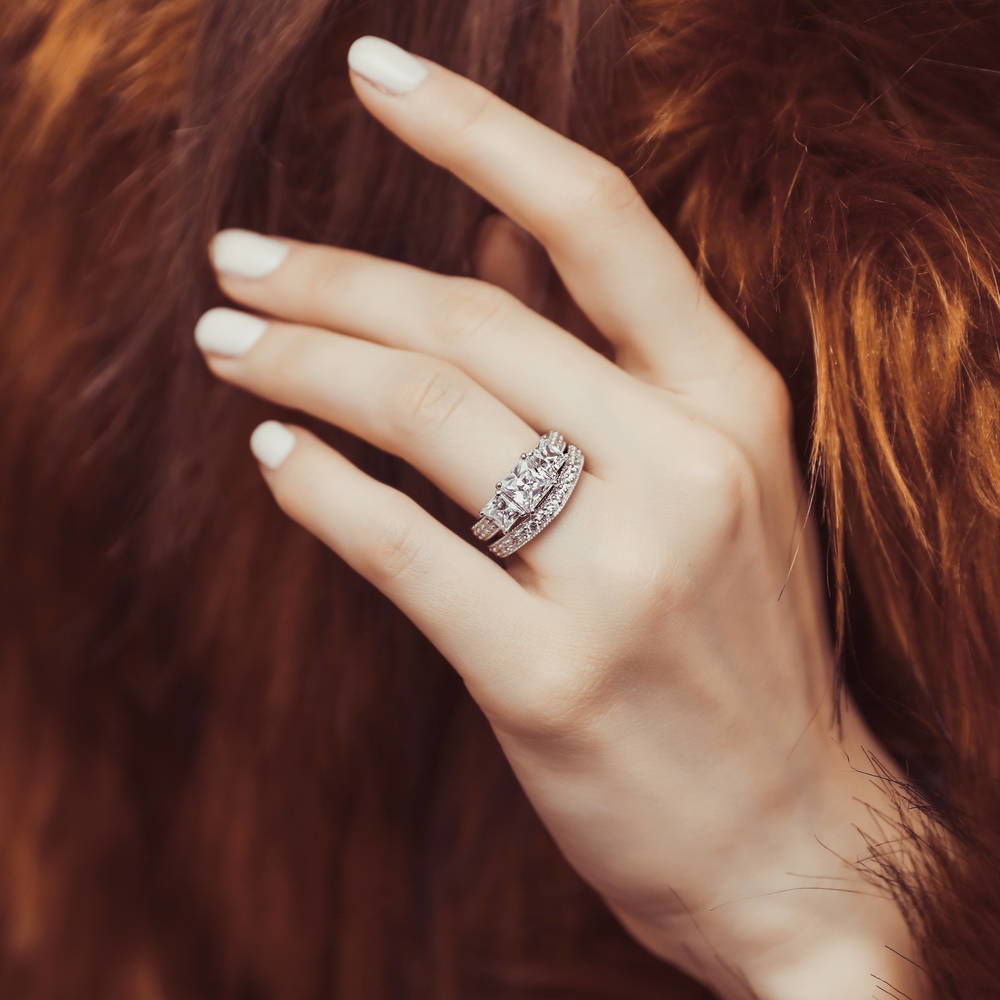 Model wearing 3-Stone Princess CZ Ring Set in Sterling Silver