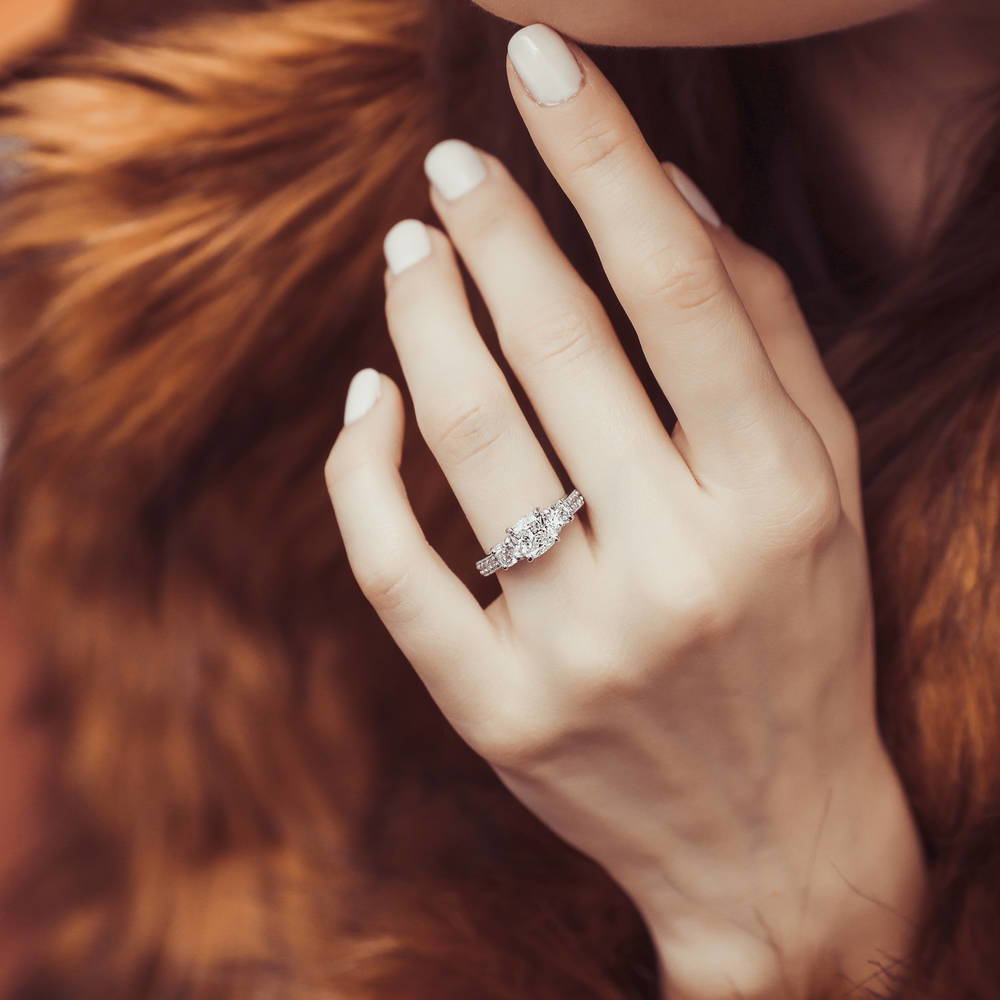 Model wearing 3-Stone Cushion CZ Ring in Sterling Silver