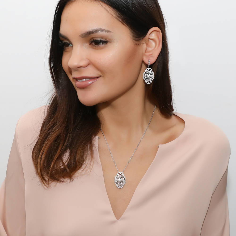 Model wearing Flower Art Deco CZ Pendant Necklace in Sterling Silver