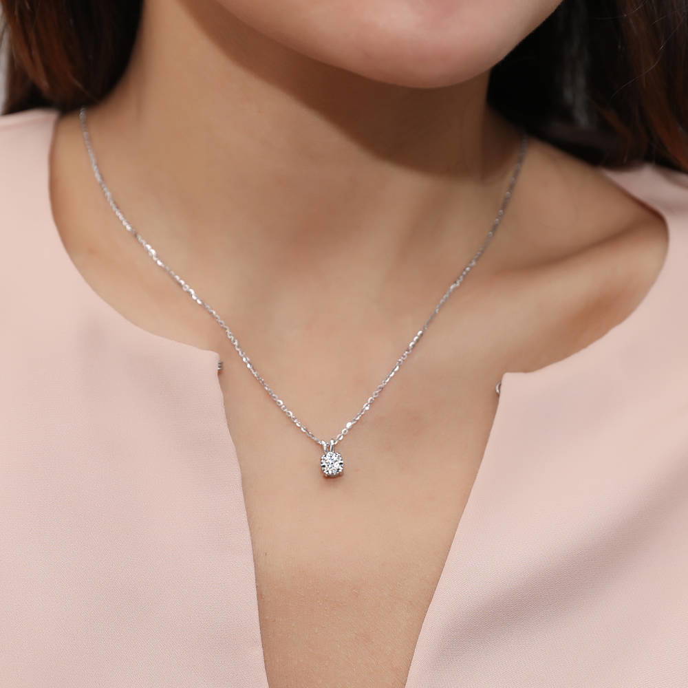 Model wearing Solitaire Round CZ Pendant Necklace in Sterling Silver 0.8ct