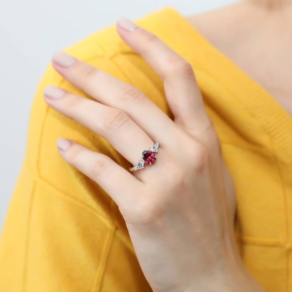 Model wearing 3-Stone Red Oval CZ Ring in Sterling Silver