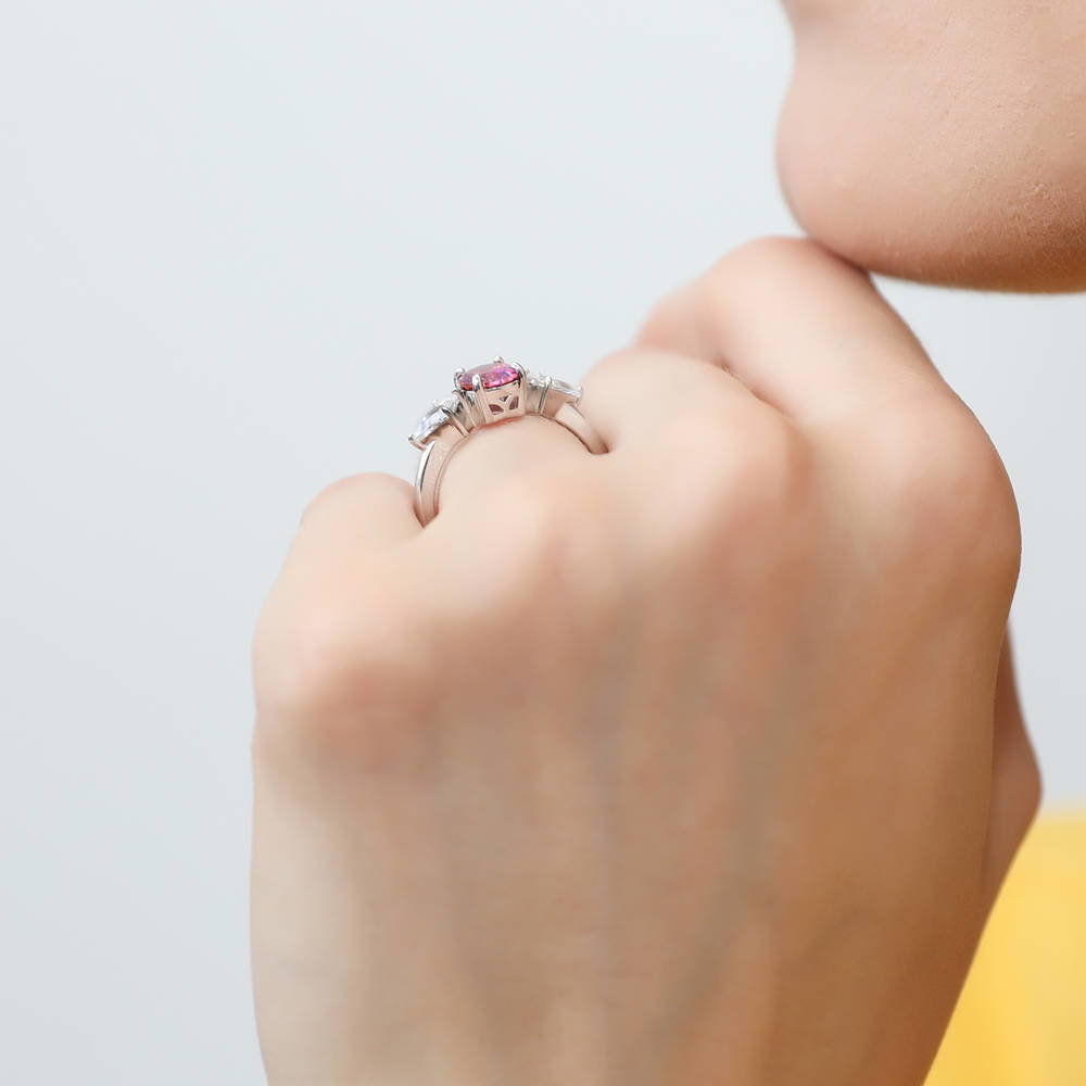 Model wearing 3-Stone Red Oval CZ Ring in Sterling Silver