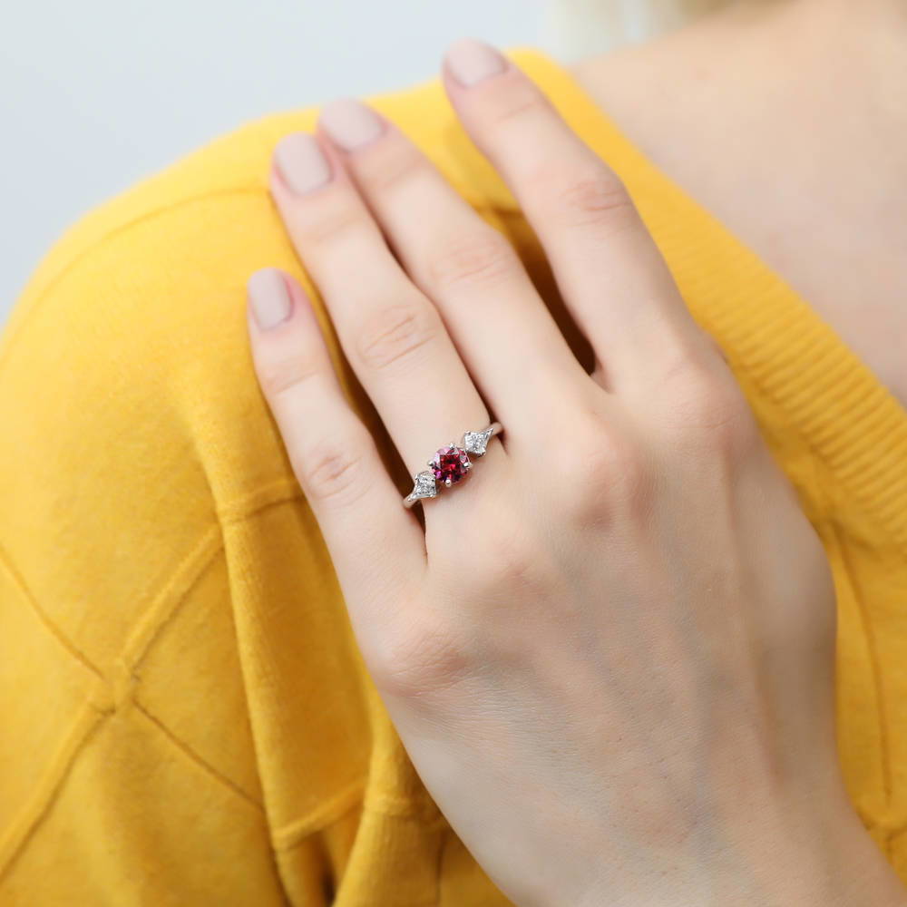 Model wearing 3-Stone Red Round CZ Ring in Sterling Silver