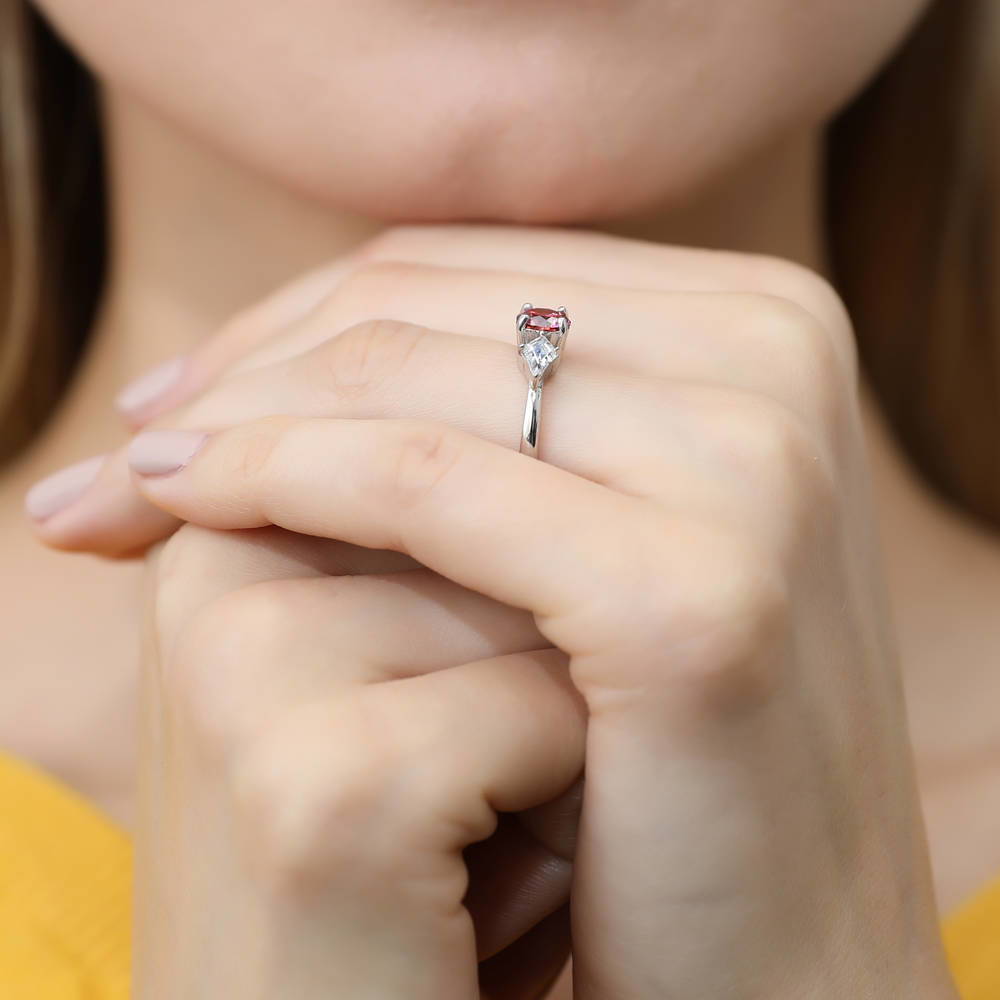 Model wearing 3-Stone Red Round CZ Ring in Sterling Silver