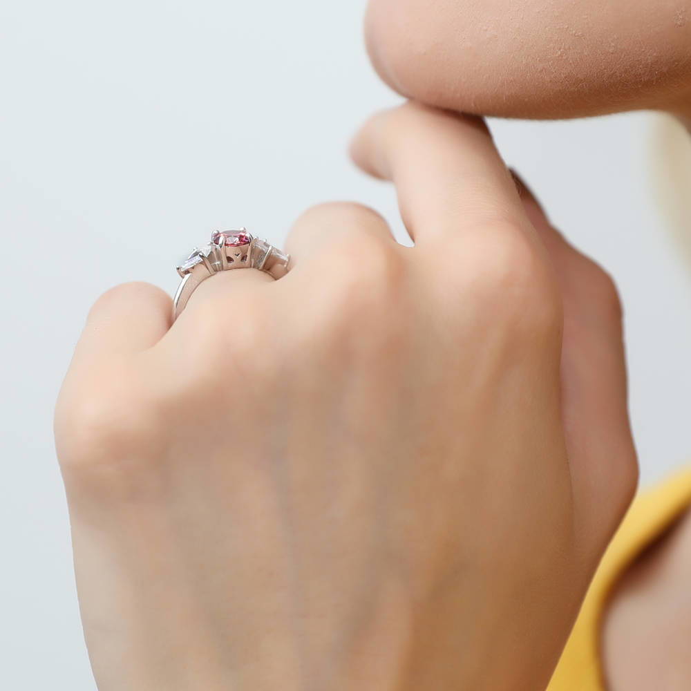 Model wearing 3-Stone Red Round CZ Ring in Sterling Silver