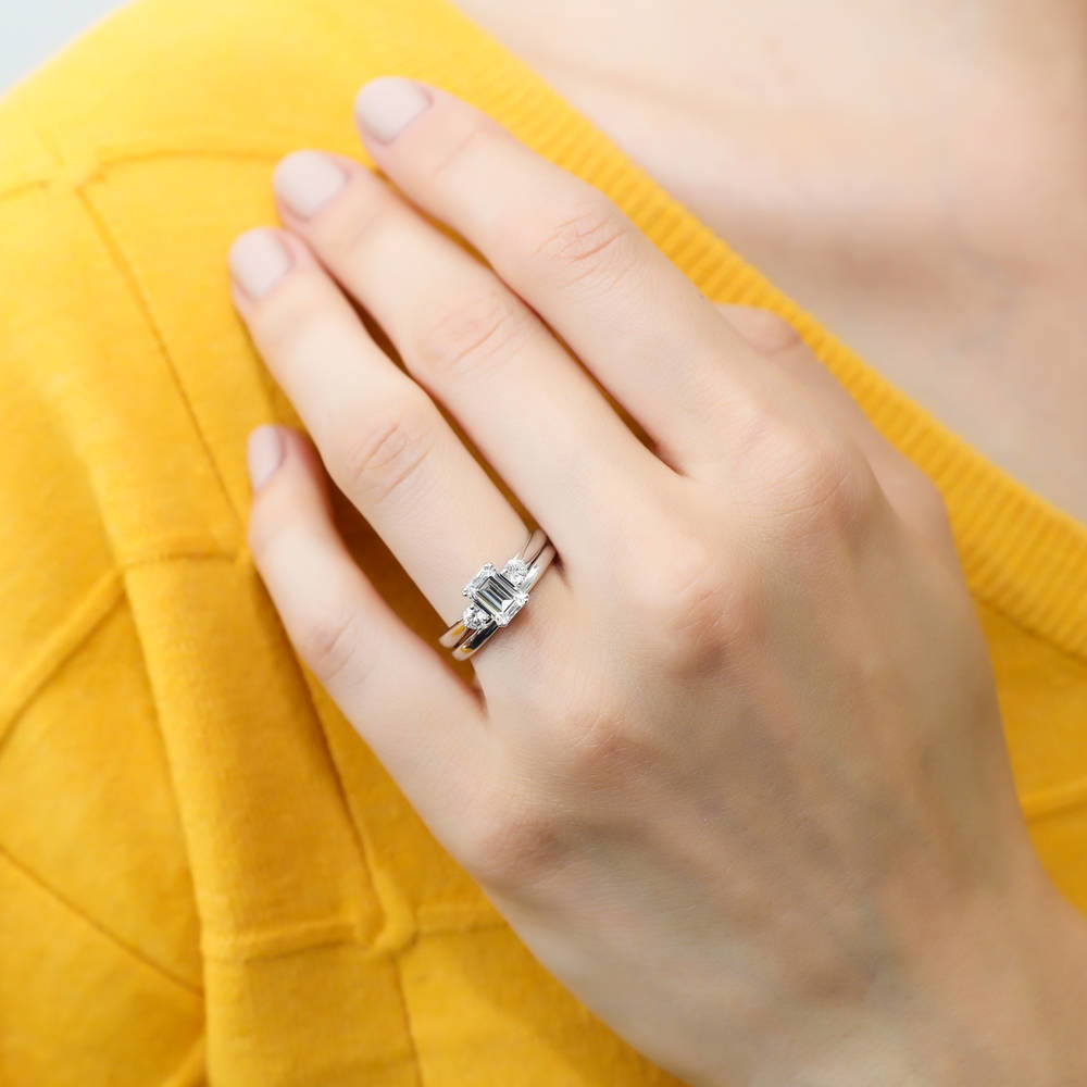 Model wearing 3-Stone Emerald Cut CZ Ring Set in Sterling Silver