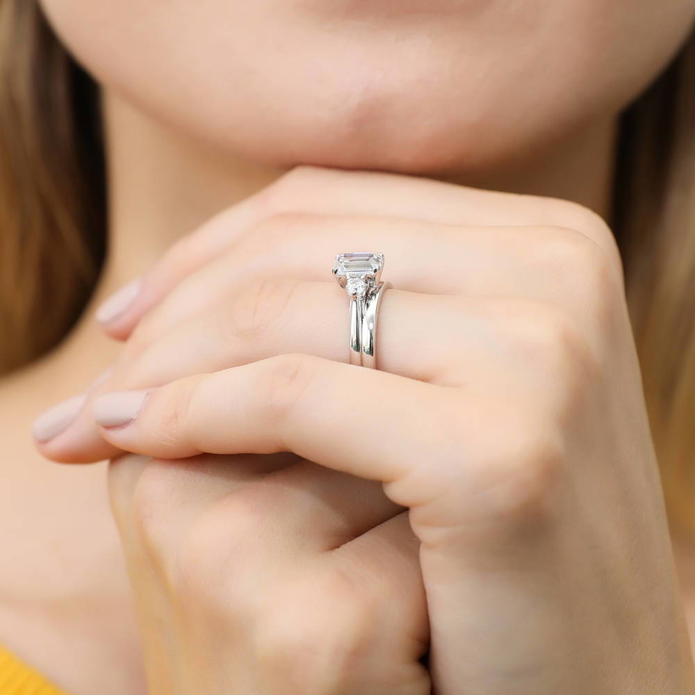 Model wearing 3-Stone Emerald Cut CZ Ring Set in Sterling Silver