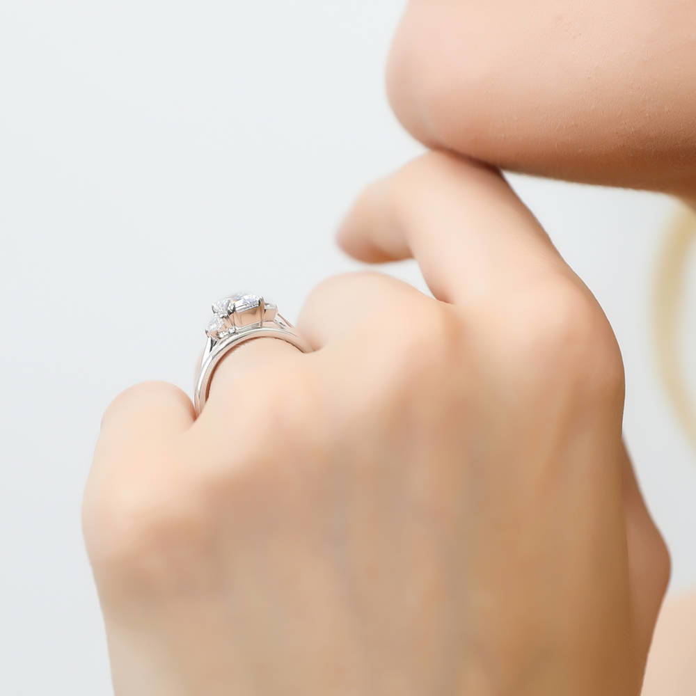 Model wearing 3-Stone Emerald Cut CZ Ring Set in Sterling Silver