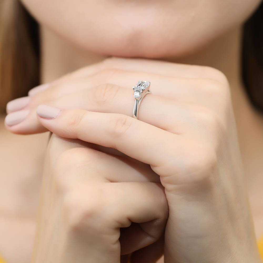 Model wearing 3-Stone East-West Emerald Cut CZ Ring in Sterling Silver