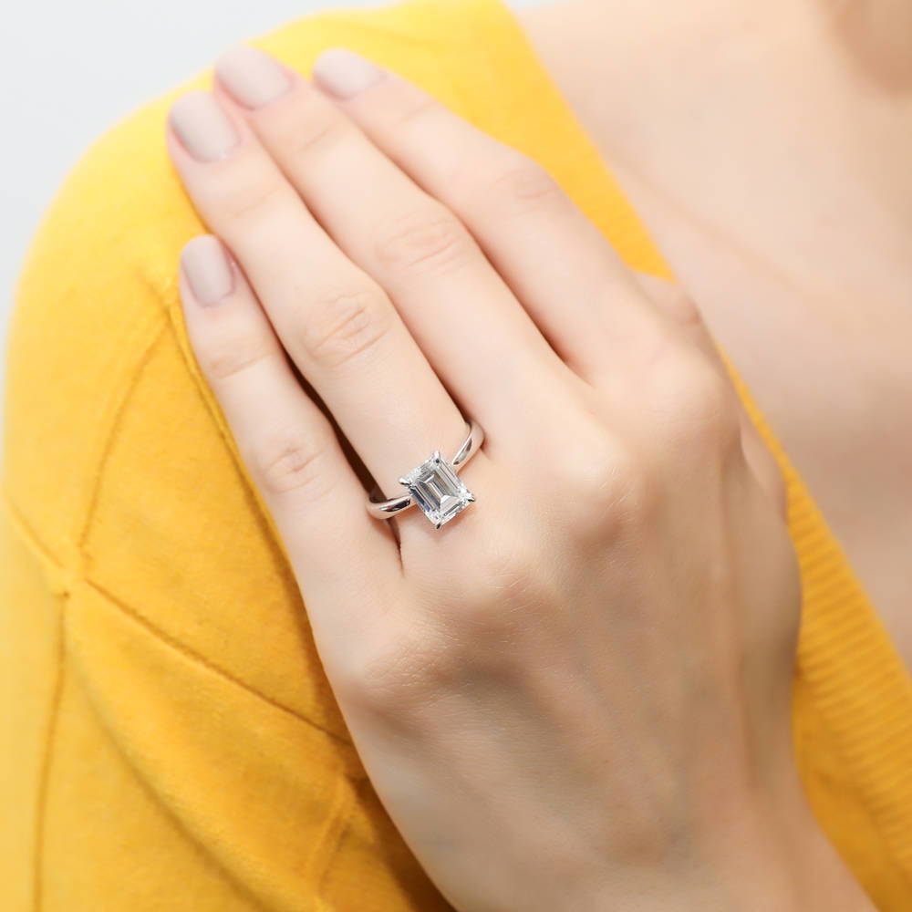 Model wearing Solitaire 2.6ct Emerald Cut CZ Ring in Sterling Silver, 2 of 8