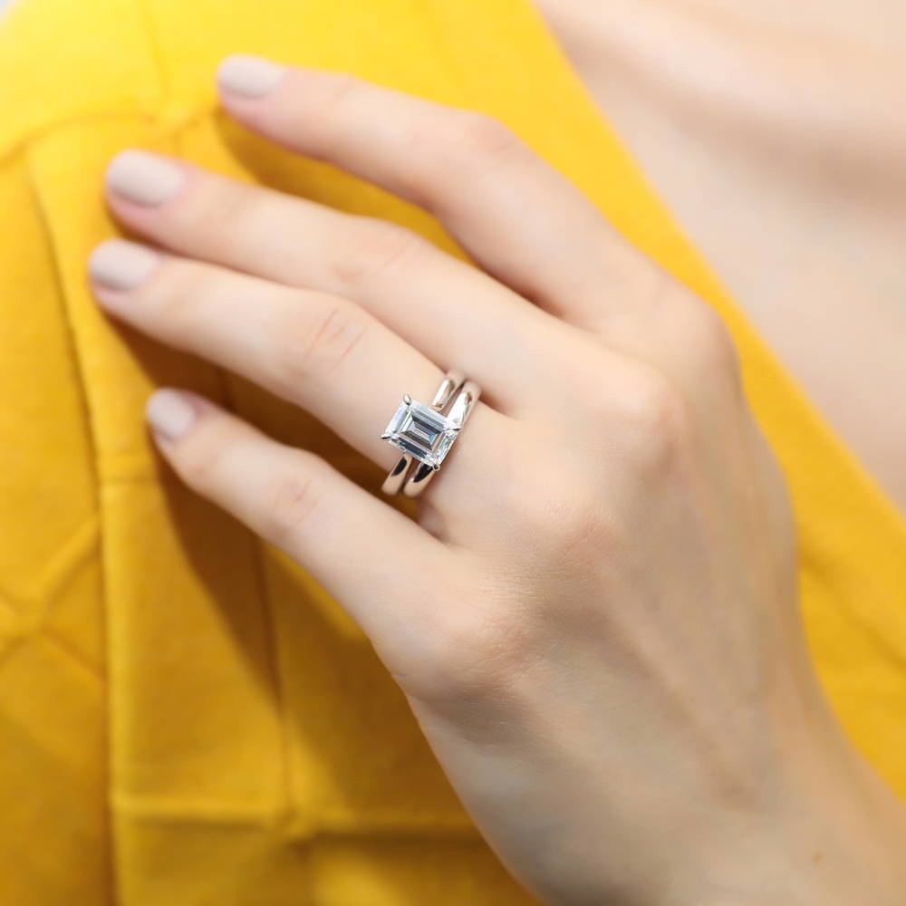 Model wearing Solitaire 2.6ct Emerald Cut CZ Ring Set in Sterling Silver, 2 of 12