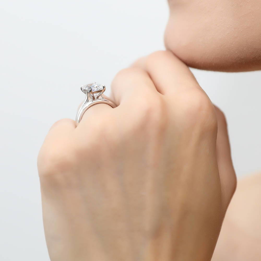 Model wearing Solitaire 2.6ct Emerald Cut CZ Ring Set in Sterling Silver, 3 of 12
