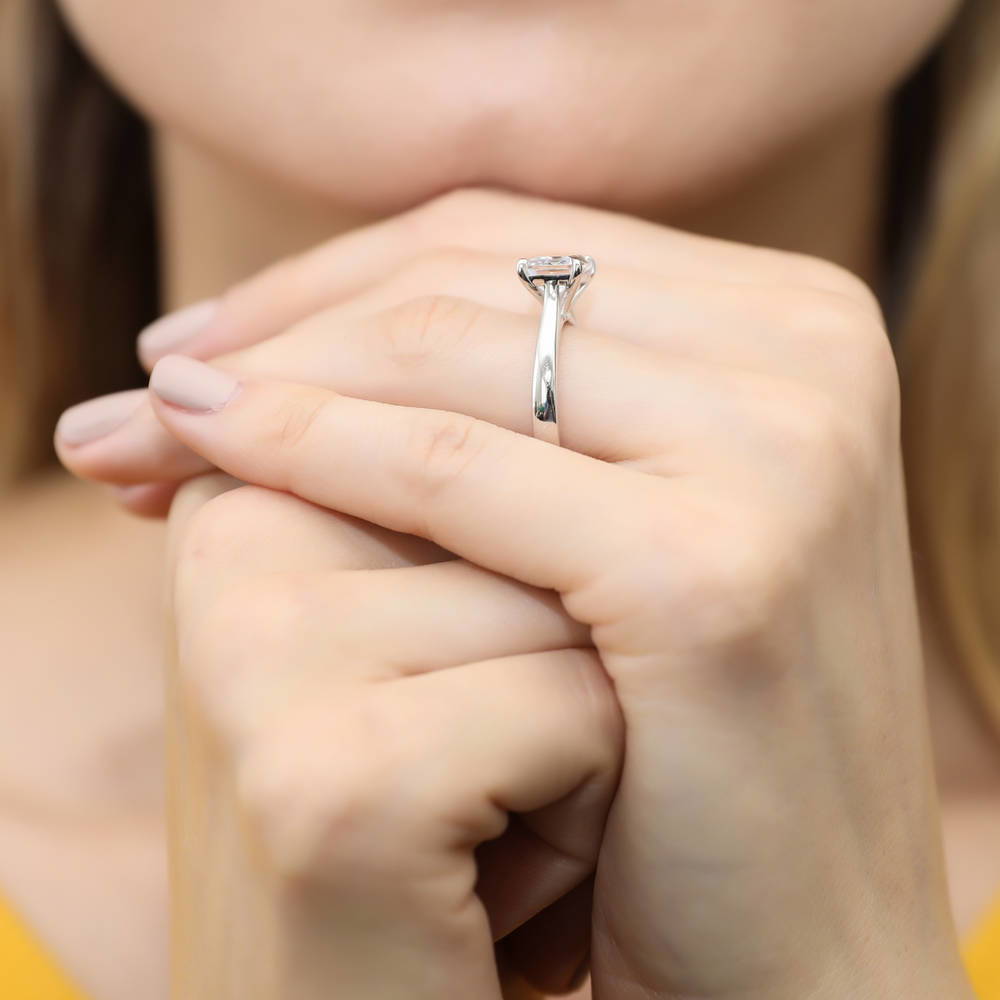 Model wearing Solitaire East-West 2.6ct Emerald Cut CZ Ring in Sterling Silver