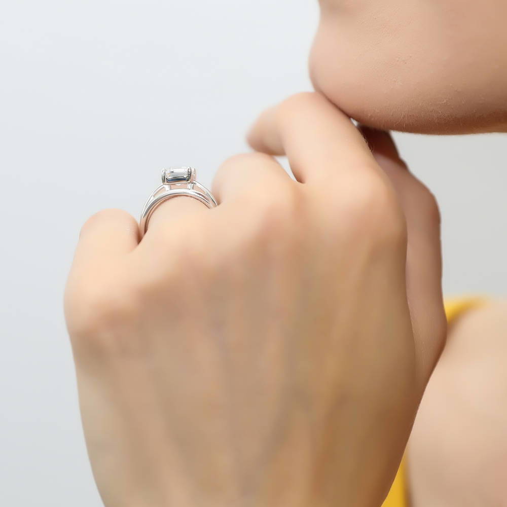 Model wearing Solitaire 2.1ct Emerald Cut CZ Ring Set in Sterling Silver