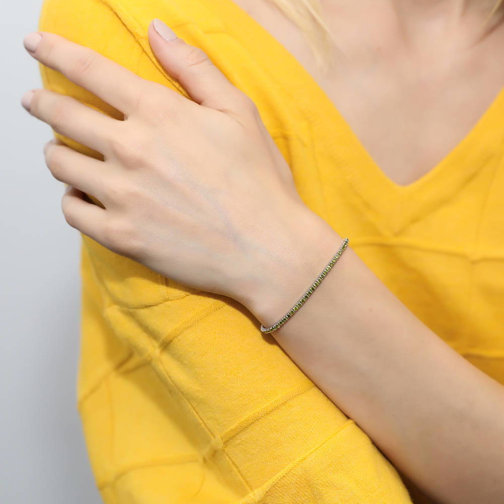 Model wearing CZ Tennis Bracelet Gold Flashed, Green Color