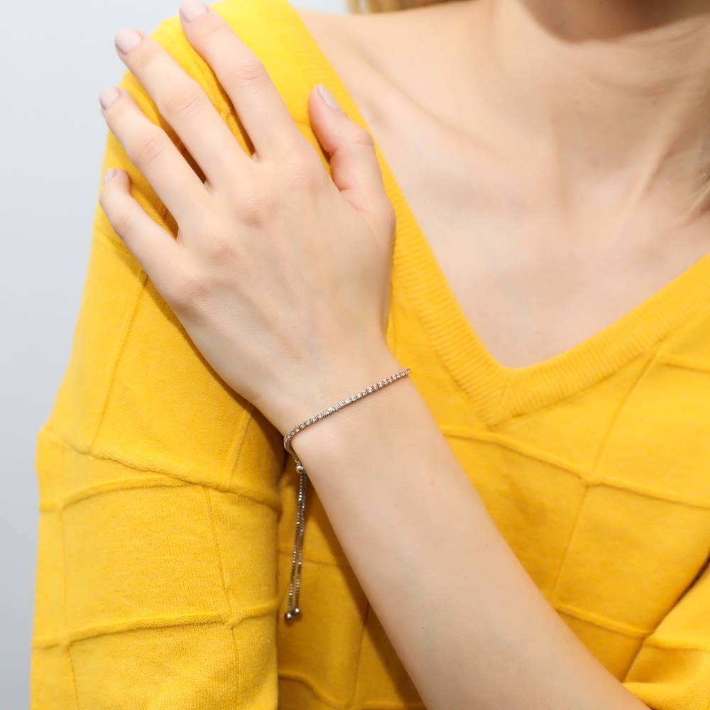 Model wearing CZ Tennis Bracelet Gold Flashed, Champagne Color