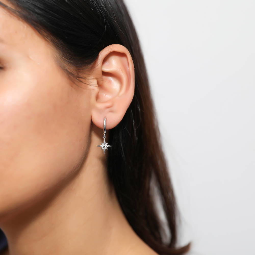 Model wearing Starburst CZ Dangle Earrings in Sterling Silver