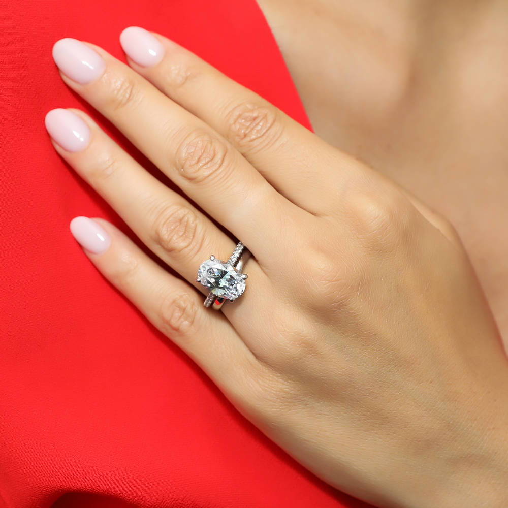 Model wearing Solitaire 5.5ct Oval CZ Ring Set in Sterling Silver, 6 of 13