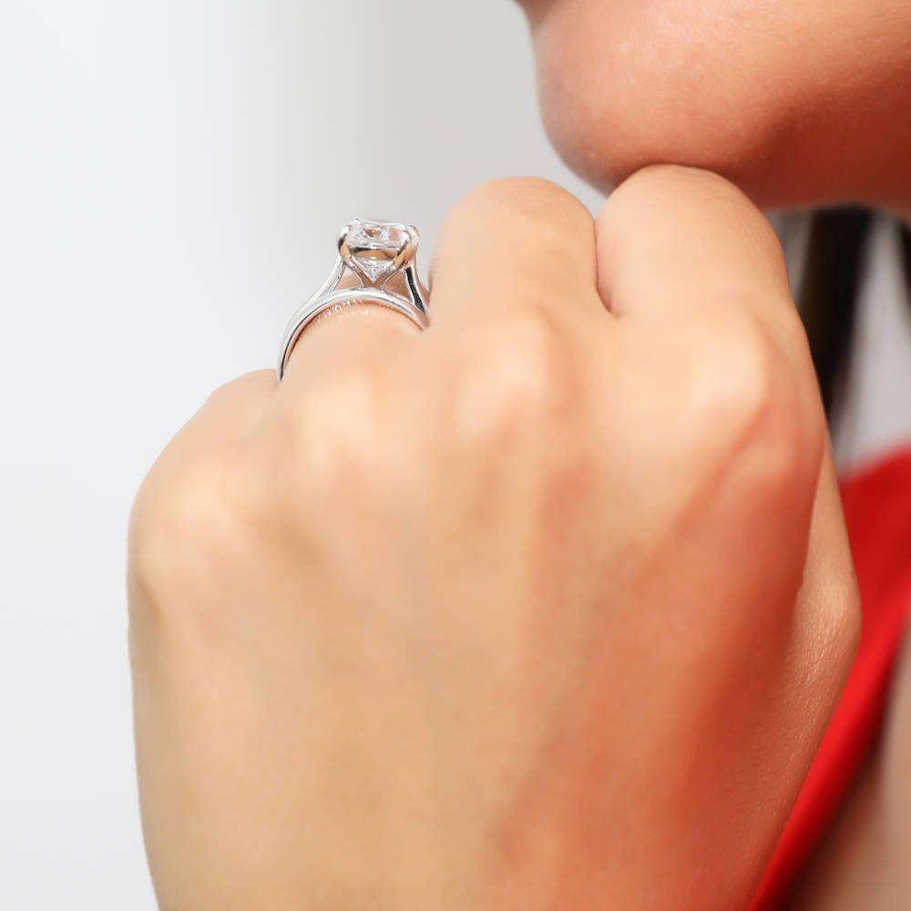 Model wearing Solitaire 5.5ct Oval CZ Ring Set in Sterling Silver