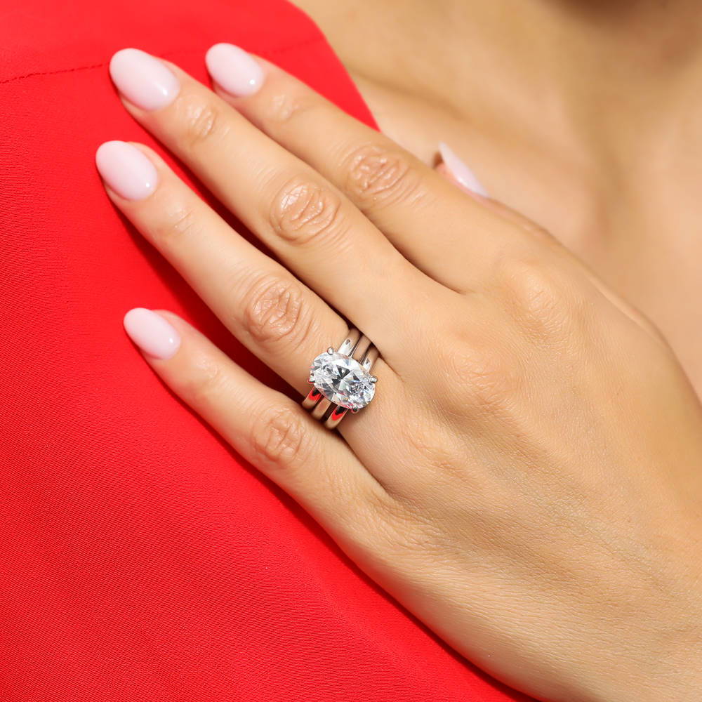 Model wearing Solitaire 5.5ct Oval CZ Ring Set in Sterling Silver