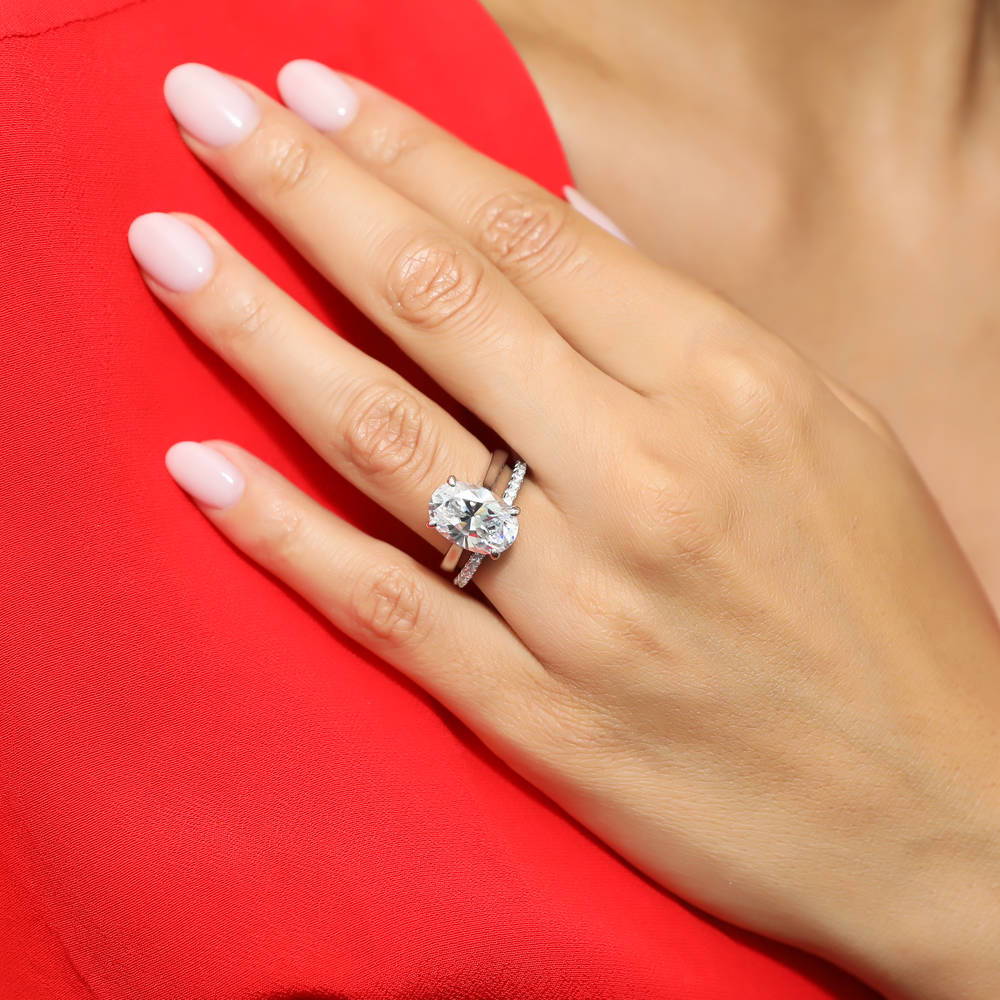 Model wearing Solitaire 5.5ct Oval CZ Ring Set in Sterling Silver