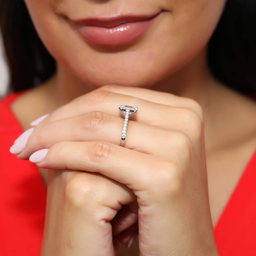 Model wearing Solitaire 2.6ct Emerald Cut CZ Ring in Sterling Silver