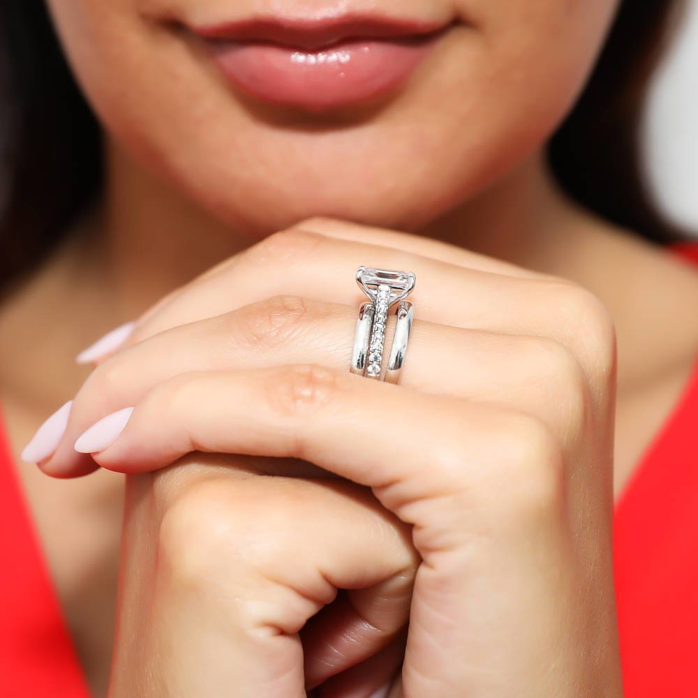 Model wearing Solitaire 2.6ct Emerald Cut CZ Ring Set in Sterling Silver