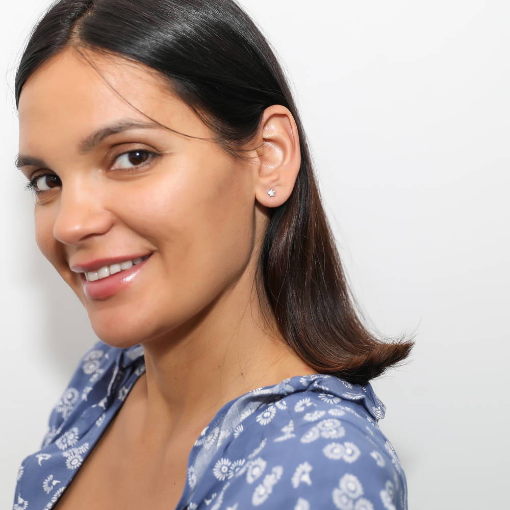 Model wearing Star Stud Earrings in Sterling Silver