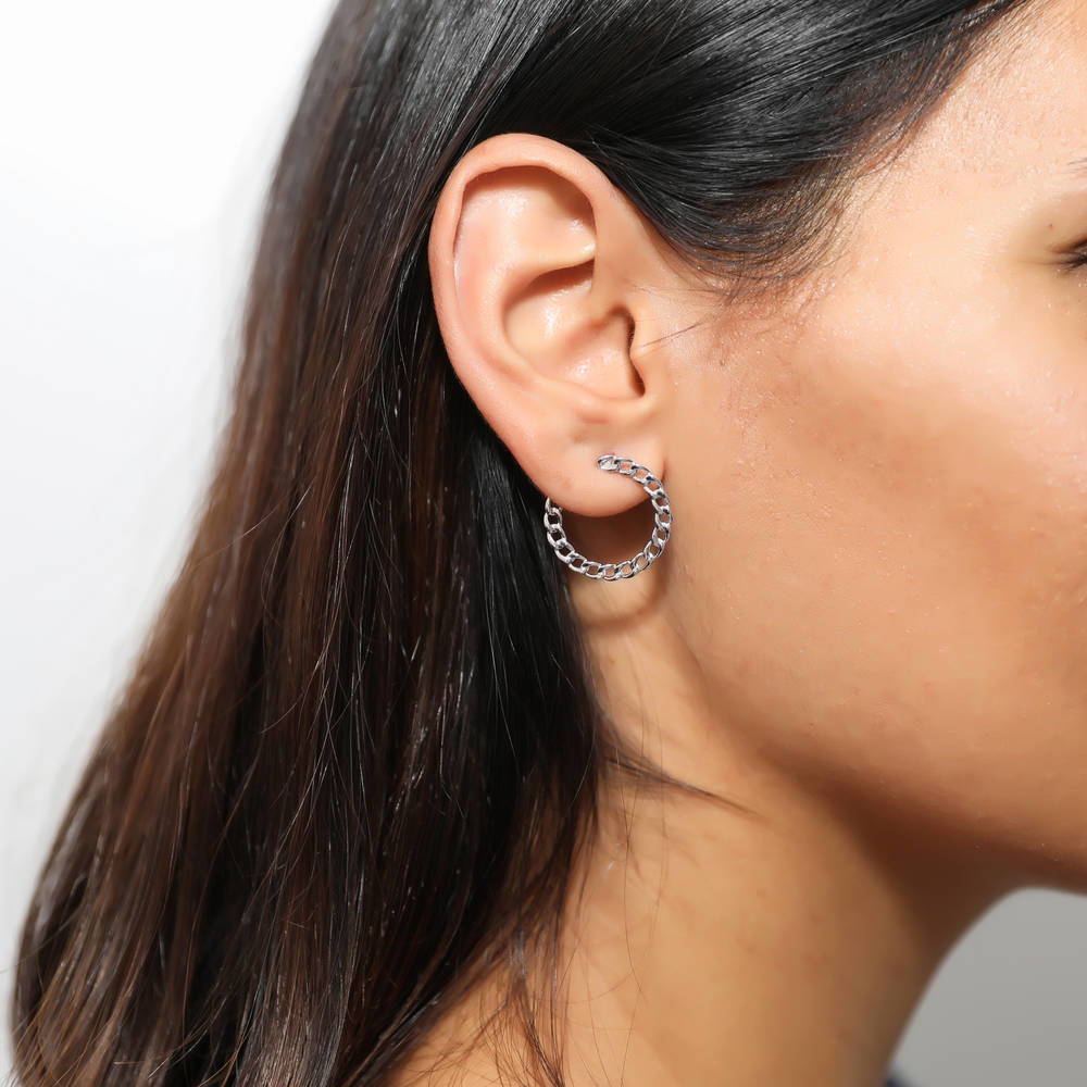 Model wearing Woven Medium Half Hoop Earrings in Sterling Silver 0.75 inch