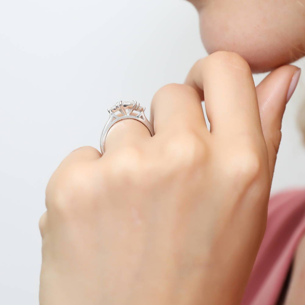 Model wearing 3-Stone East-West Oval CZ Ring in Sterling Silver, 3 of 8
